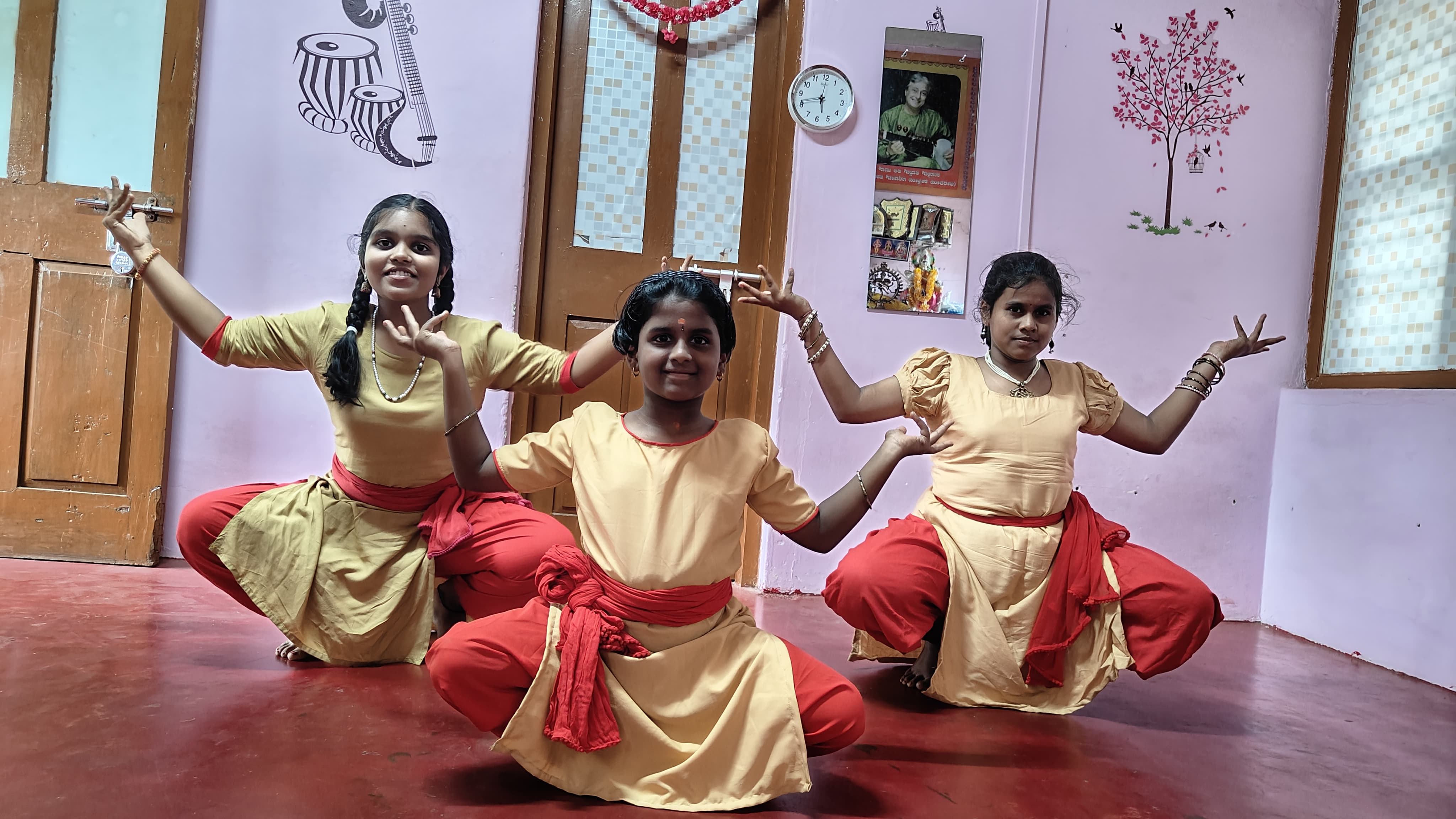 Bharatanatyam students holding a classical pose