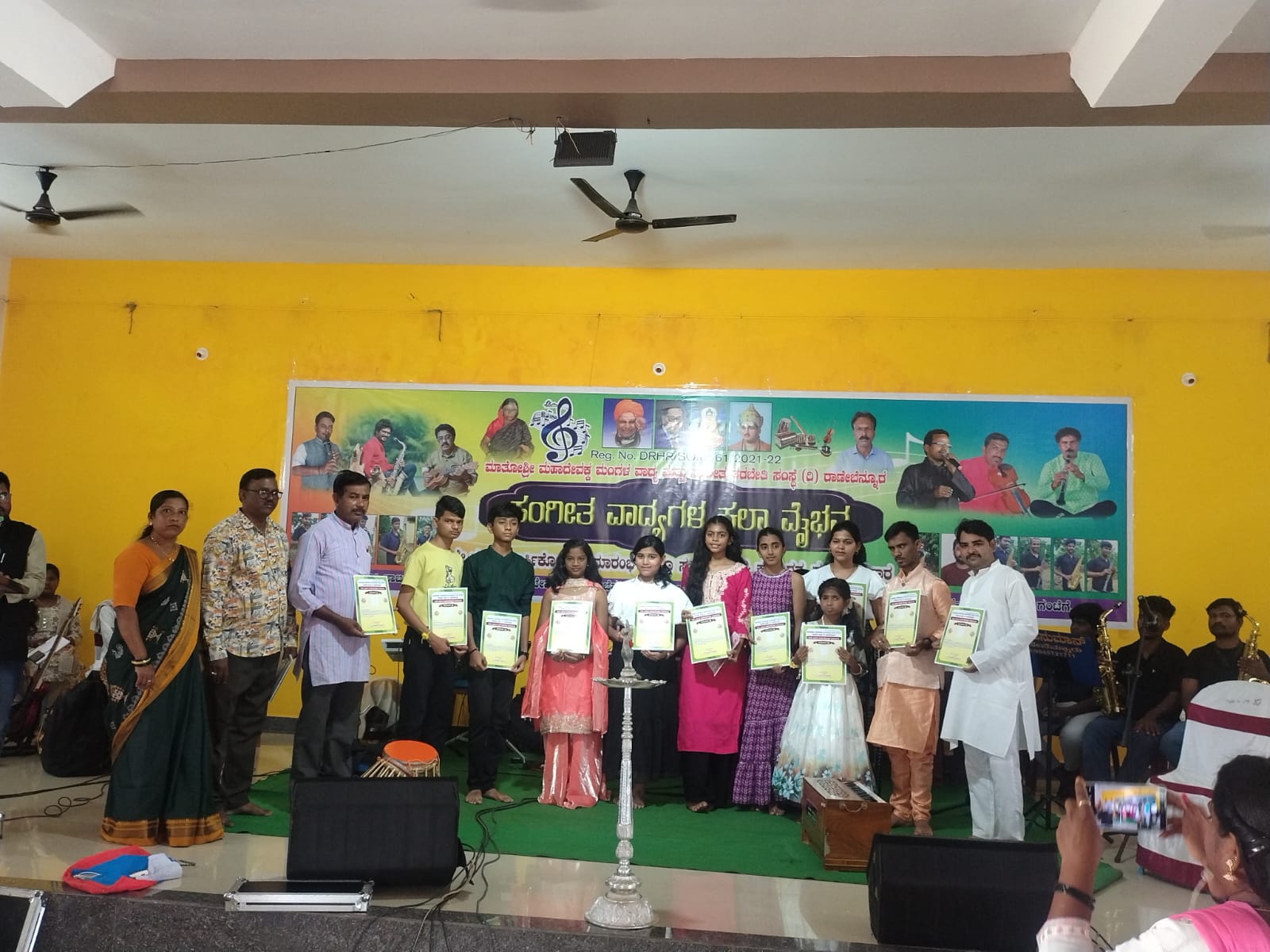 Students receiving certificates at an institute function