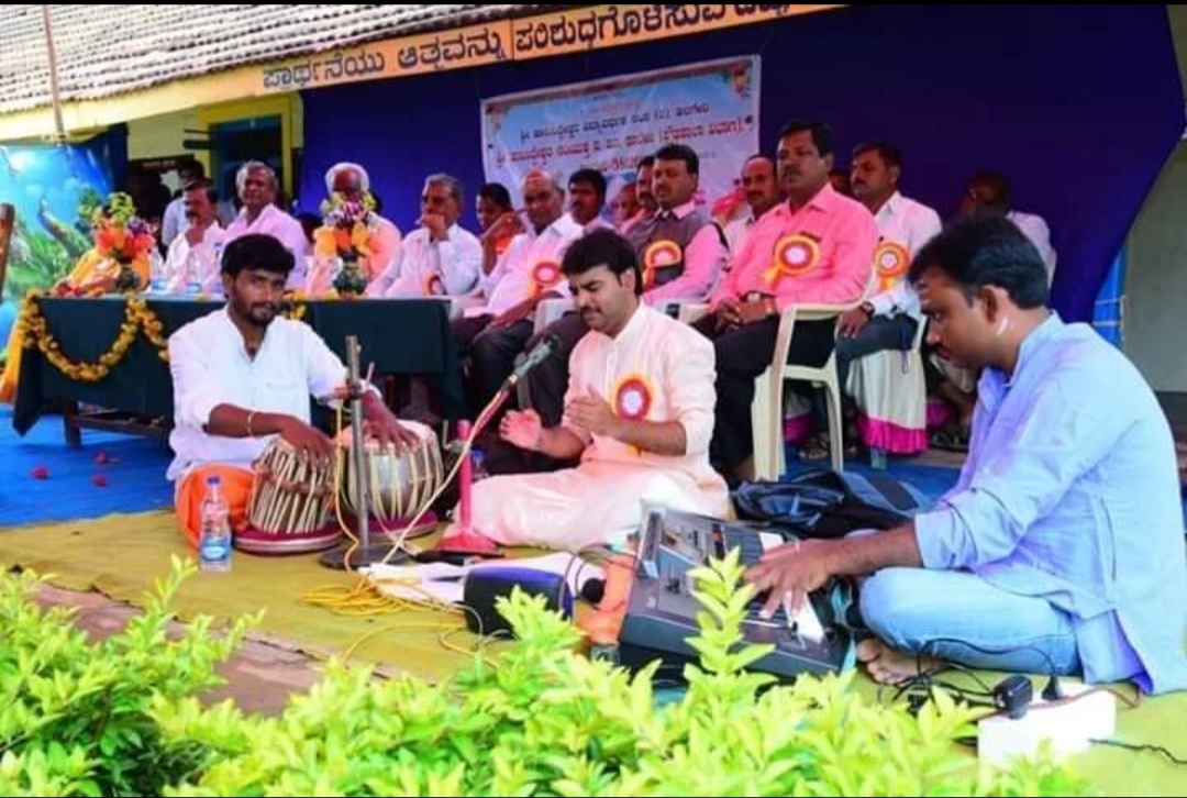 An outdoor cultural programme with vocal, tabla and keyboard accompaniment